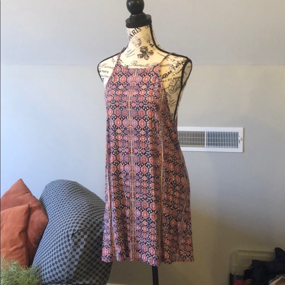 Pink patterned dress size medium but runs small.